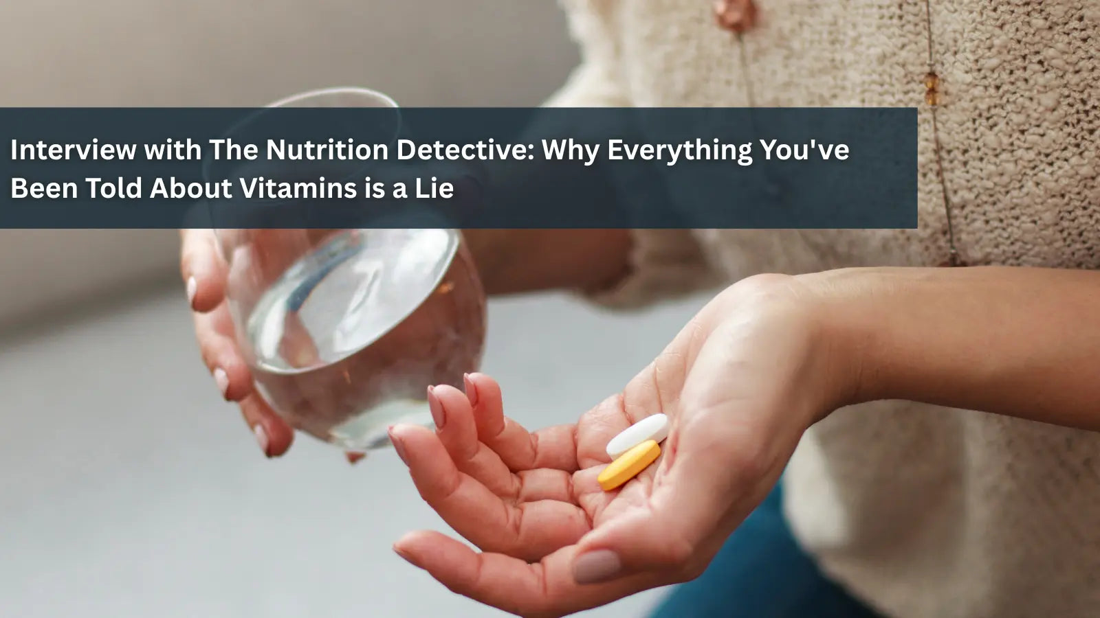 A person holding a glass of water in one hand and two vitamin pills (one white, one yellow) in their open palm, questioning common beliefs about vitamin supplementation.