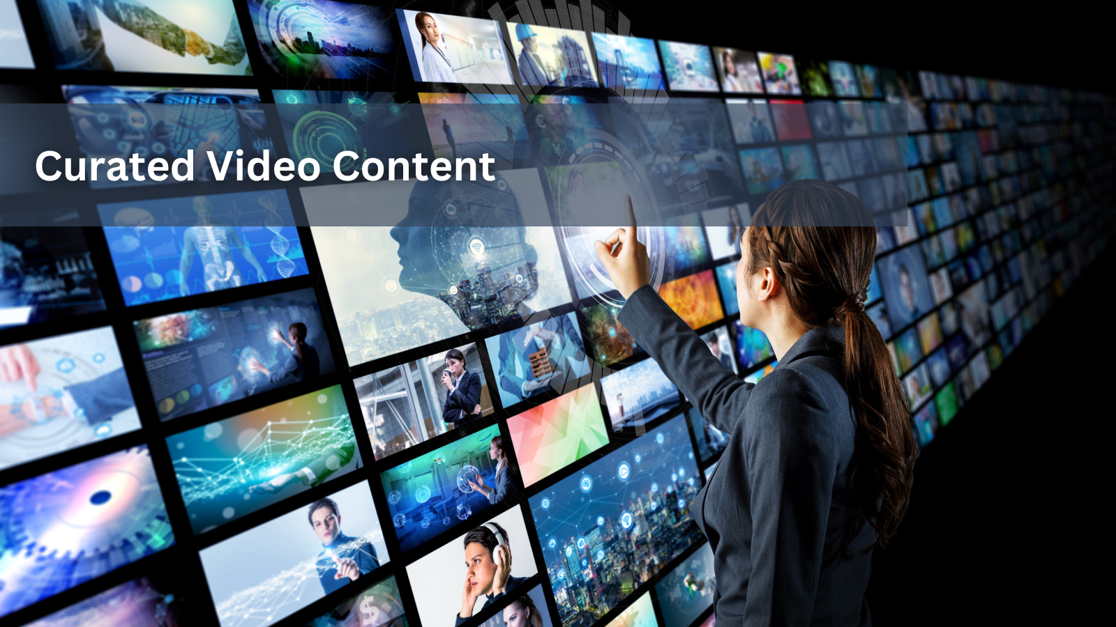 A woman in a suit touches a futuristic wall of multiple screens displaying videos and abstract data.