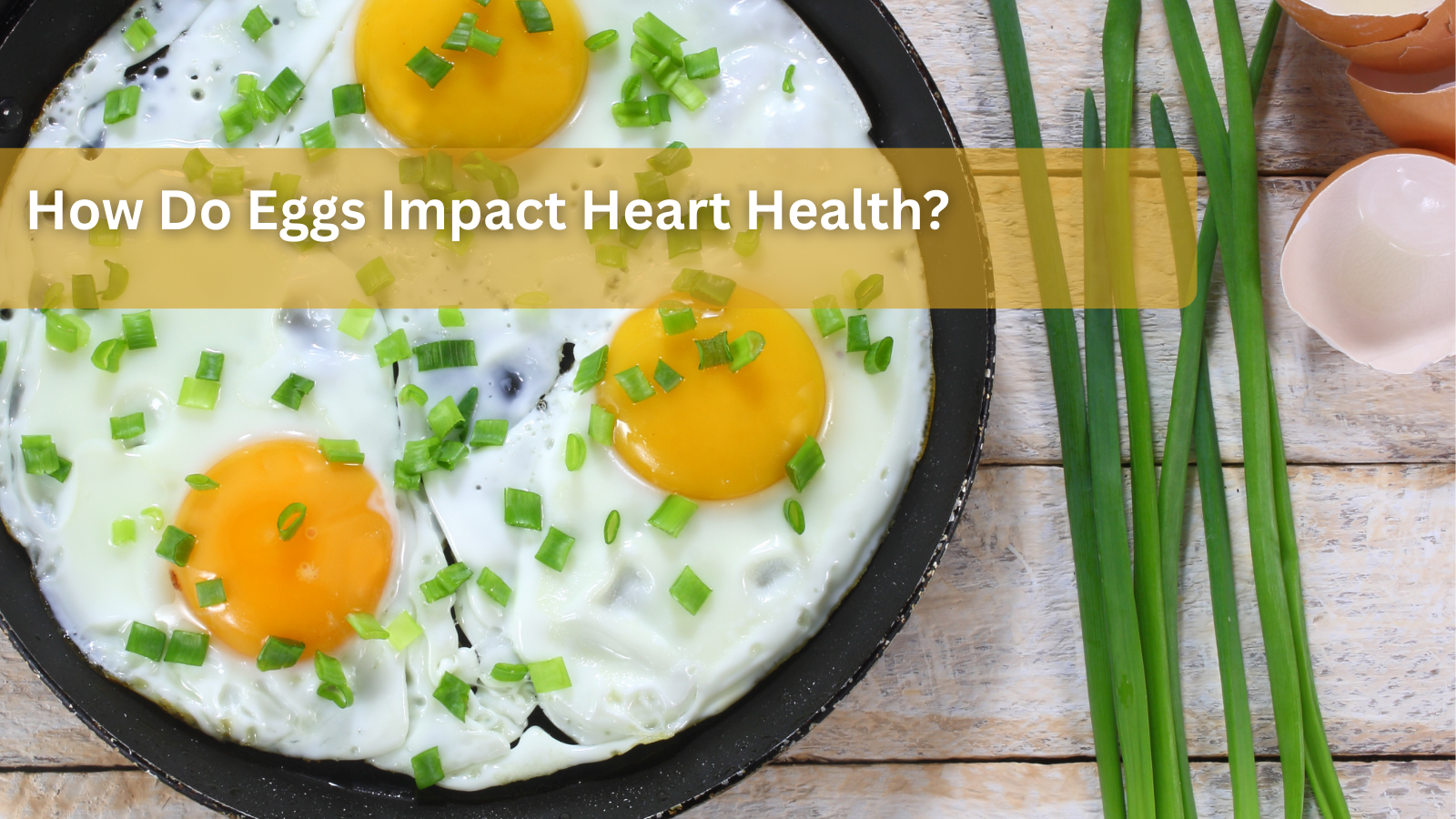 Fried eggs with green onions in a pan.