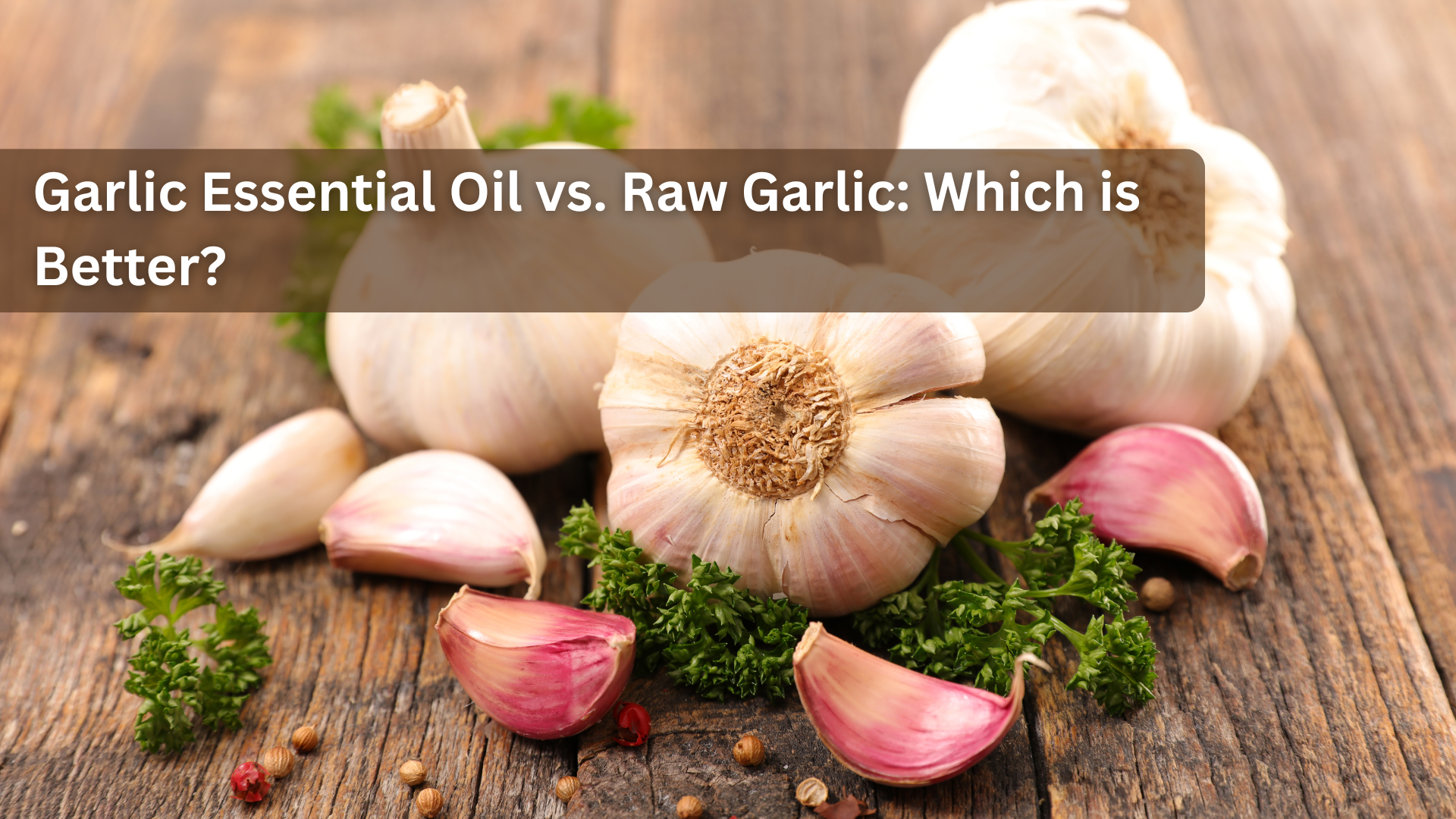 Whole garlic bulbs and pink cloves on a wooden surface with parsley.