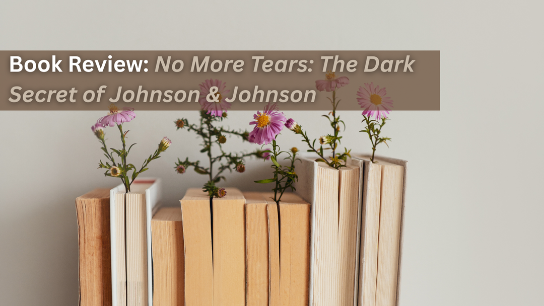 Pink flowers growing out of a row of books.