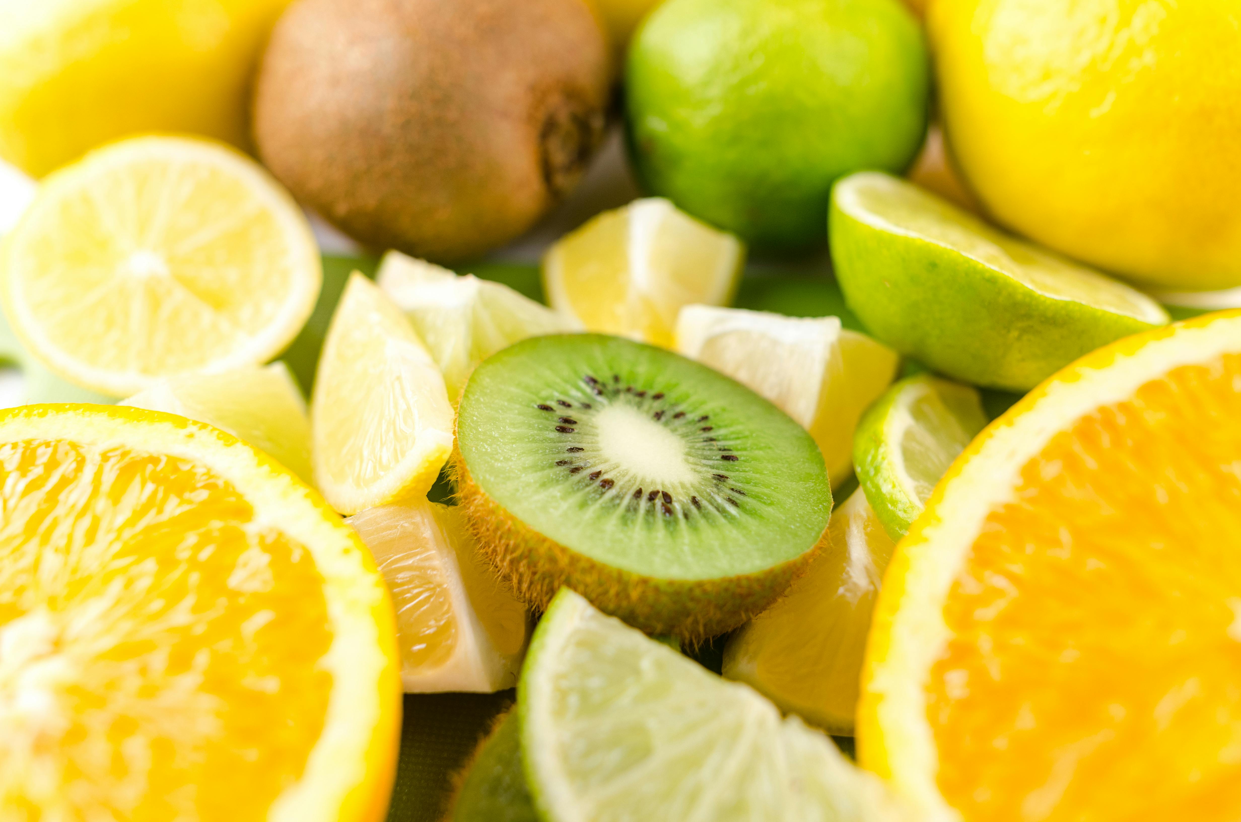 Sliced oranges, lemons, limes, and kiwi.