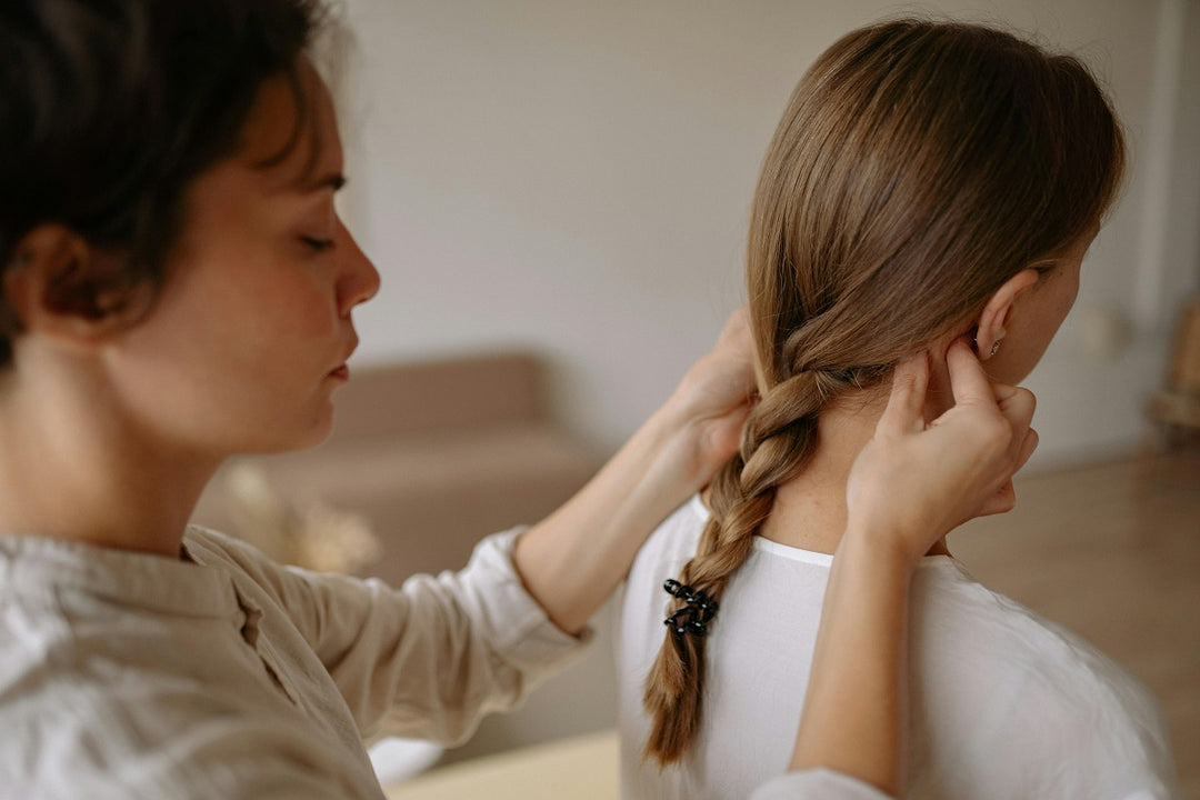 A person receiving a gentle neck massage.