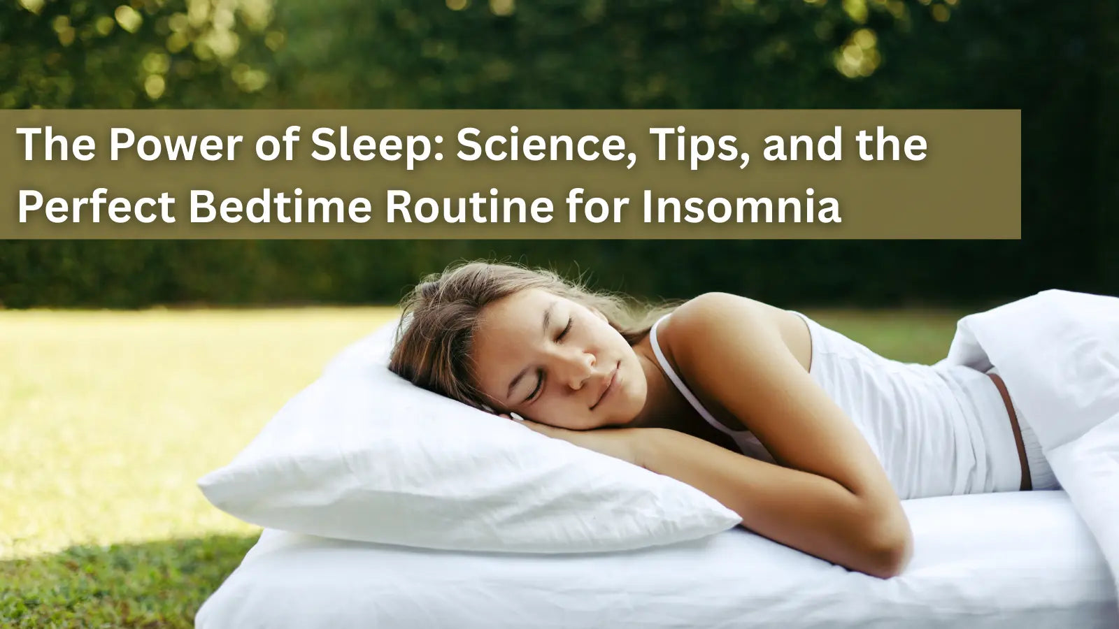  This image shows a young woman sleeping peacefully on a white pillow and mattress outdoors on a green lawn.